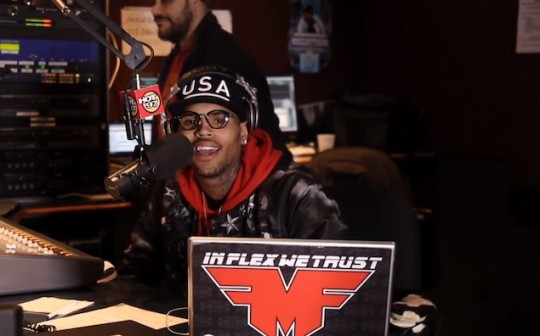 Chris-Brown-Promotes-Album-in-NYC-wearing-Thom-Browne-Eyeglasses-Givenchy-Plane-Print-Reversible-Bomber-Jacket-and-Diamond-Supply-Pullover-Hoodie-3
